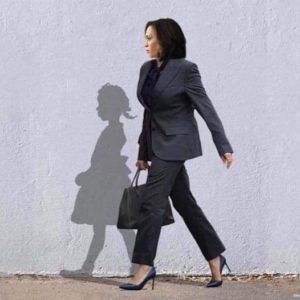 Vice President Elect Kamala Harris walks beside a silhouette of a young Ruby Bridges on her way to school 